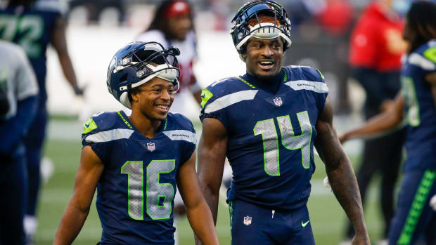 Nov 1, 2020; Seattle, Washington, USA; Seattle Seahawks wide receiver Tyler Lockett (16) and wide receiver DK Metcalf (14) return to the locker room following a 37-27 victory against the San Francisco 49ers at CenturyLink Field.